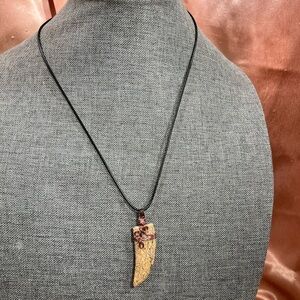 Wire Wrapped Jasper cut into a Shark Tooth Wrapped in Antique Bronze Wire.